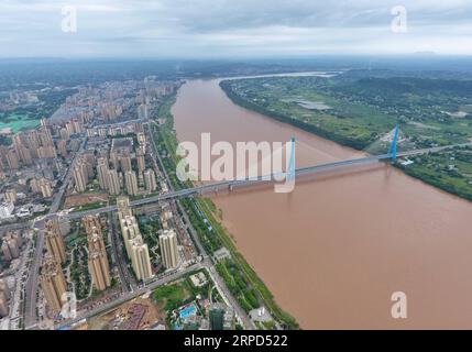 (190723) -- YIBIN, July 23, 2019 -- Aerial photo taken on July 23, 2019 shows Nanxi Xianyuan Yangtze River Bridge in Nanxi District of Yibin City, southwest China s Sichuan Province. The bridge opened to the public traffic on Jan. 30, 2019, by which local residents no longer need a ferry to cross the river. ) CHINA-SICHUAN-YIBIN-YANGTZE RIVER BRIDGE (CN) LiuxKun PUBLICATIONxNOTxINxCHN Stock Photo