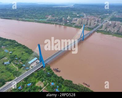 (190723) -- YIBIN, July 23, 2019 -- Aerial photo taken on July 23, 2019 shows Nanxi Xianyuan Yangtze River Bridge in Nanxi District of Yibin City, southwest China s Sichuan Province. The bridge opened to the public traffic on Jan. 30, 2019, by which local residents no longer need a ferry to cross the river. ) CHINA-SICHUAN-YIBIN-YANGTZE RIVER BRIDGE (CN) LiuxKun PUBLICATIONxNOTxINxCHN Stock Photo