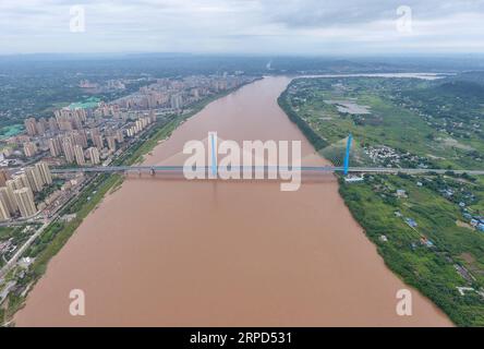 (190723) -- YIBIN, July 23, 2019 -- Aerial photo taken on July 23, 2019 shows Nanxi Xianyuan Yangtze River Bridge in Nanxi District of Yibin City, southwest China s Sichuan Province. The bridge opened to the public traffic on Jan. 30, 2019, by which local residents no longer need a ferry to cross the river. ) CHINA-SICHUAN-YIBIN-YANGTZE RIVER BRIDGE (CN) LiuxKun PUBLICATIONxNOTxINxCHN Stock Photo