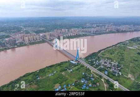 (190723) -- YIBIN, July 23, 2019 -- Aerial photo taken on July 23, 2019 shows Nanxi Xianyuan Yangtze River Bridge in Nanxi District of Yibin City, southwest China s Sichuan Province. The bridge opened to the public traffic on Jan. 30, 2019, by which local residents no longer need a ferry to cross the river. ) CHINA-SICHUAN-YIBIN-YANGTZE RIVER BRIDGE (CN) LiuxKun PUBLICATIONxNOTxINxCHN Stock Photo