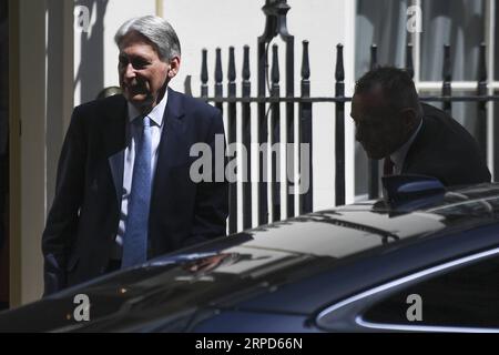 (190724) -- LONDON, July 24, 2019 -- British Chancellor of the Exchequer Philip Hammond leaves 11 Downing Street in London, Britain on July 24, 2019. (Photo by Alberto Pezzali/Xinhua) BRITAIN-LONDON-CHANCELLOR OF THE EXCHEQUER HanxYan PUBLICATIONxNOTxINxCHN Stock Photo