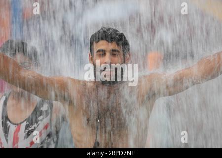 (190726) -- BEIJING, July 26, 2019 () -- A man cools off at a water park in Baghdad, Iraq, on July 25, 2019. A new heatwave has engulfed Iraq with temperatures jumping to around 50 degrees Celsius in the southern provinces, the Iraqi meteorological monitoring body said Thursday. () PHOTOS OF THE DAY Xinhua PUBLICATIONxNOTxINxCHN Stock Photo