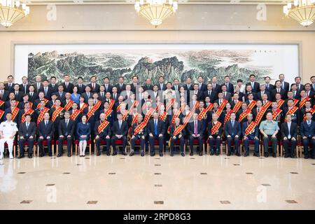 (190726) -- BEIJING, July 26, 2019 -- Chinese President Xi Jinping, also general secretary of the Communist Party of China (CPC) Central Committee and chairman of the Central Military Commission, meets with representatives who are in Beijing to attend a national conference on the work of veterans affairs in Beijing, capital of China, July 26, 2019. Li Keqiang and Wang Huning, both members of the Standing Committee of the Political Bureau of the CPC Central Committee, also attended the meeting. ) CHINA-BEIJING-XI JINPING-VETERANS-REPRESENTATIVES-MEETING (CN) LixXueren PUBLICATIONxNOTxINxCHN Stock Photo