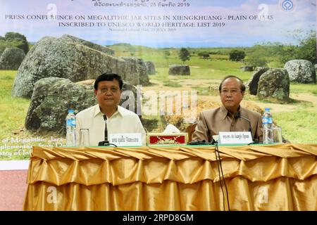 (190726) -- VIENTIANE, July 26, 2019 -- Lao Minister of Information, Culture and Tourism Bosengkham Vongdara (R) and Bountone Chanthaphone, governor of Xieng Khuang Province, attend a press conference in Vientiane, capital of Laos, July 25, 2019. Bosengkham Vongdara hosted a press conference on Thursday afternoon confirming UNESCO s acknowledgement of the Plain of Jars, a megalithic archaeological landscape in Xieng Khuang Plateau, as a UNESCO s World Heritage site. The Plain of Jars has become the third Lao UNESCO World Heritage site, after Luang Prabang inscribed in 1995, and pre-Angkor Vat Stock Photo