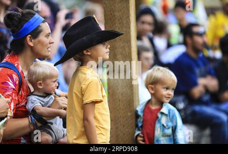(190726) -- CHEYENNE (U.S.), July 26, 2019 -- People watch a performance at the Indian Village at the Cheyenne Frontier Days in Cheyenne, the United States, July 24, 2019. Cheyenne Frontier Days is held here from July 19 to 28, featuring rodeo events, concerts, parades and art shows. ) U.S.-CHEYENNE-FRONTIER DAYS LixYing PUBLICATIONxNOTxINxCHN Stock Photo