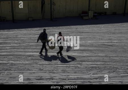 (190727) -- WEST JAVA, July 27, 2019 -- Merchants walk on thick ash to evacuate their belongings after eruption of Mount Tangkuban Parahu at Subang, West Java, Indonesia, July 27, 2019. Popular destination of Tangkuban Parahu volcano in Indonesia s West Java province erupted on Friday afternoon, spewing volcanic ash 200 meters into the air. (Photo by /Xinhua) INDONESIA-WEST JAVA-MOUNT TANGKUBAN PARAHU-AFTER ERUPTION Syarif PUBLICATIONxNOTxINxCHN Stock Photo