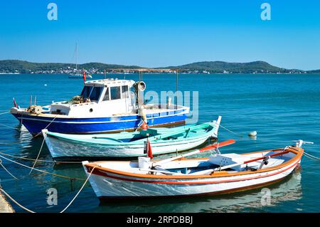 Wooden fishing boats on the beach at Cunda island in Balikesir Ayvalik, Turkey, september 11 2020 Stock Photo