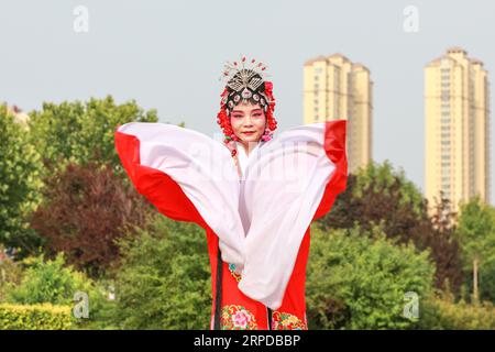 Luannan County, China - June 26, 2019: Peking Opera performers rehearse in the park, Luannan County, Hebei Province, China Stock Photo
