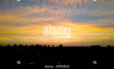 (190730) -- BEIJING, July 30, 2019 -- Photo taken with a mobile phone shows sunset glow after rain in Beijing, capital of China, July 29, 2019. ) (BeijingCandid)CHINA-BEIJING-SUMMER (CN) ZhangxChao PUBLICATIONxNOTxINxCHN Stock Photo