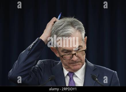 (190801) -- BEIJING, Aug. 1, 2019 -- U.S. Federal Reserve Chairman Jerome Powell reacts during a press conference in Washington D.C., the United States, on July 31, 2019. U.S. Federal Reserve on Wednesday lowered interest rates for the first time since the 2008 global financial crisis, amid rising concerns over trade tensions, a slowing global economy and muted inflation pressures. The Federal Open Market Committee, the Fed s rate-setting body, trimmed the target for the federal funds rate by 25 basis points to a range of 2 percent to 2.25 percent after concluding its two-day policy meeting, i Stock Photo