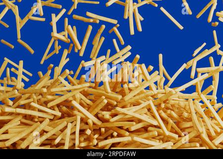 French fries falling down and forming a pile. Fast food. Chips. Blue background Stock Photo