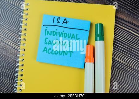Concept of ISA - Individual Saving Account write on sticky notes isolated on Wooden Table. Stock Photo