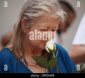 (190804) -- DAYTON (U.S.), Aug. 4, 2019 -- A woman attends a prayer vigil for the victims of the mass shooting in Dayton of Ohio, the United States, on Aug. 4, 2019. Nine people were killed with 26 others injured early Sunday morning in a mass shooting near a bar in Dayton, a city in midwest U.S. state of Ohio, the authorities said. The gunman was shot dead at the scene by police. ) U.S.-OHIO-DAYTON-MASS SHOOTING-AFTERMATH LiuxJie PUBLICATIONxNOTxINxCHN Stock Photo