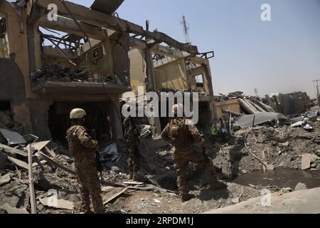 (190807) -- KABUL, Aug. 7, 2019 -- Afghan security force members inspect at the site of an explosion in Kabul, capital of Afghanistan, Aug. 7, 2019. At least 95 people were wounded after a massive car bomb explosion ripped through a busy neighborhood at the western side of Afghanistan s capital Kabul on Wednesday, an official said. ) AFGHANISTAN-KABUL-CAR BOMB BLAST RahmatullahxAlizadah PUBLICATIONxNOTxINxCHN Stock Photo