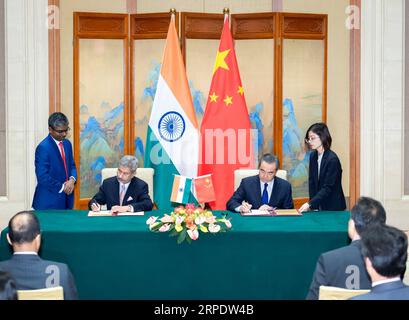 (190812) -- BEIJING, Aug. 12, 2019 -- Chinese State Councilor and Foreign Minister Wang Yi (2nd R, back) signs a document with Indian Minister of External Affairs Subrahmanyam Jaishankar after co-chairing the second meeting of the China-India high-level people-to-people exchanges mechanism, in Beijing, capital of China, Aug. 12, 2019. ) CHINA-BEIJING-WANG YI-INDIAN EXTERNAL AFFAIRS MINISTER-EXCHANGE-MECHANISM (CN) ZhaixJianlan PUBLICATIONxNOTxINxCHN Stock Photo