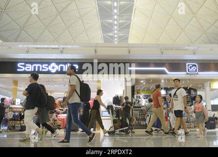 (190814) -- HONG KONG, Aug. 14, 2019 -- Passengers are seen at Hong Kong International Airport in Hong Kong, south China, Aug. 14, 2019. Airport Authority Hong Kong said earlier Wednesday that it has obtained an interim injunction to restrain persons from unlawfully and willfully obstructing or interfering with the proper use of the airport. ) CHINA-HONG KONG-AIRPORT (CN) WangxShen PUBLICATIONxNOTxINxCHN Stock Photo