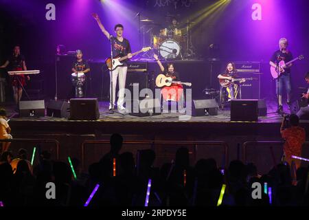 (190815) -- BEIJING, Aug. 15, 2019 -- Members of the band 8772 perform during the launching ceremony of the band s first album in Beijing, capital of China, Aug. 14, 2019. After three-year efforts, the band 8772 released their first album titled Never Rare featuring ten original songs in Beijing Wednesday. An audience of about 300 attended the launching ceremony and watched performances staged by the band. Most members of the band suffer rare diseases including brittle bone diseases, Kallmann Syndrome and spinal muscular atrophy. The band is named 8772 as it resembles the letters BTTZ, the ini Stock Photo