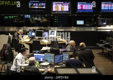 (190815) -- BUENOS AIRES, Aug. 15, 2019 -- Staff members work at a stock exchange in Buenos Aires, Argentina, Aug. 14, 2019. Argentinean President Mauricio Macri announced on Wednesday a package of economic measures aimed at providing relief to the population after the economic turmoil caused by his government s defeat in the primary elections on Sunday. (Photo by /Xinhua) ARGENTINA-BUENOS AIRES-ECONOMIC MEASURES MartinxZabala PUBLICATIONxNOTxINxCHN Stock Photo