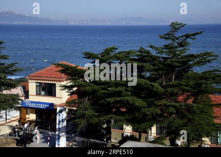 (190818) -- QINGDAO, Aug. 18, 2019 -- Photo taken on Aug. 17, 2019 shows the health service center on the Lingshan Island of Qingdao, east China s Shandong Province. The Lingshan Island is located some nine sea miles southeast off the west coast of Qingdao. Since 2013, the west coast new area has dispatched medical staff members to work by turns on the island. The 40-year-old Zhou was selected in 2018 as a general practitioner to work at the island s health service center. Despite harsh working and living conditions, Zhou and his colleagues never get slack at their work to provide medical serv Stock Photo
