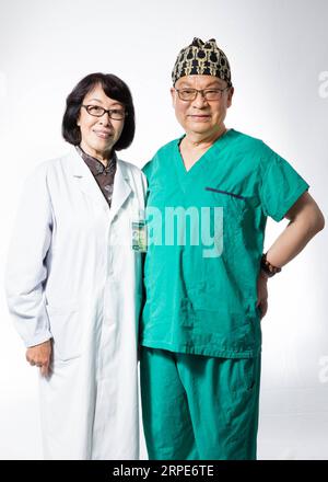 (190819) -- BEIJING, Aug. 19, 2019 -- Lang Jinghe (R), academician of Chinese Academy of Engineering and chief physician of gynaecology and obstetrics department, and his wife Hua Guiru, chief physician of physical medicine rehabilitation department, pose for a photo at their work place of the Peking Union Medical College Hospital in Beijing, capital of China, Aug. 16, 2019. China has about 3.6 million qualified physicians and 4.1 million registered nurses. They have formed a strong force to support the most significant medical service system in the world of safeguarding the health of 1.4 bill Stock Photo