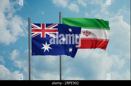 Iran flag and Australia flag waving together on blue sky Stock Photo