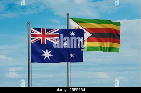 Zimbabwe and Australia flags waving together in the wind on blue cloudy ...