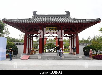 (190823) -- BEIJING, Aug. 23, 2019 -- Visitors are seen at the Shaanxi Garden at the Beijing International Horticultural Exhibition in Beijing, capital of China, Aug. 22, 2019. As a land-locked province, Shaanxi stretches the drainage areas of the Yangtze River and the Yellow River, the two longest rivers in China. It boasts main parts of the Qinling Mountains, one of the biodiversity hotspots worldwide, dividing northern temperate zones from subtropical zones. Meanwhile, Shaanxi is habitat of rare protected animals. Over the past years, Shaanxi Province has been promoting ecological developme Stock Photo