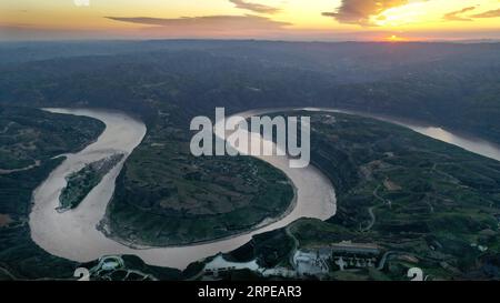 (190823) -- BEIJING, Aug. 23, 2019 -- Aerial photo taken on Aug. 14, 2019 shows the Qiankunwan river bend along the Yellow River, China s second-longest waterway, on the border between Yanchuan County, northwest China s Shaanxi Province and Yonghe County, north China s Shanxi Province. As a land-locked province, Shaanxi stretches the drainage areas of the Yangtze River and the Yellow River, the two longest rivers in China. It boasts main parts of the Qinling Mountains, one of the biodiversity hotspots worldwide, dividing northern temperate zones from subtropical zones. Meanwhile, Shaanxi is ha Stock Photo