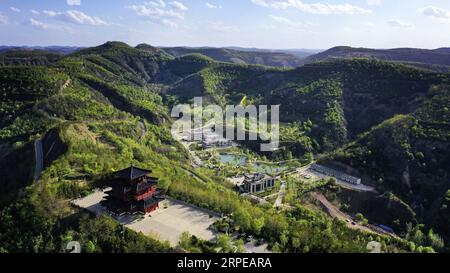 (190823) -- BEIJING, Aug. 23, 2019 -- Aerial photo taken on May 11, 2019 shows a park in Wuqi County of Yan an City, northwest China s Shaanxi Province. As a land-locked province, Shaanxi stretches the drainage areas of the Yangtze River and the Yellow River, the two longest rivers in China. It boasts main parts of the Qinling Mountains, one of the biodiversity hotspots worldwide, dividing northern temperate zones from subtropical zones. Meanwhile, Shaanxi is habitat of rare protected animals. Over the past years, Shaanxi Province has been promoting ecological development. For example, Yan an, Stock Photo