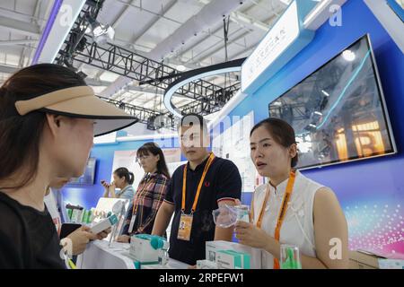 Beijing, China. 4th Sep, 2023. Staff members showcase a home use atomizer at the booth of Beijing Tongren Hospital at the exhibition area of healthcare services of the 2023 China International Fair for Trade in Services (CIFTIS) at Shougang Park in Beijing, capital of China, Sept. 4, 2023. Credit: Zhang Yuwei/Xinhua/Alamy Live News Stock Photo