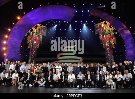 (190829) -- QINGDAO, Aug. 29, 2019 -- The Golden Seagull Awards winners pose for a group photo with guests at the awarding ceremony in Qingdao, a coastal city in east China s Shandong Province, Aug. 28, 2019. The 2019 Qingdao International Film and Television Expo dropped the curtain Wednesday in Qingdao, with the Golden Seagull Awards presented. ) CHINA-SHANDONG-QINGDAO-GOLDEN SEAGULL AWARDS (CN) LixZiheng PUBLICATIONxNOTxINxCHN Stock Photo