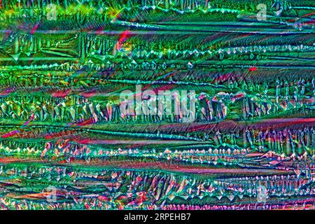 The image presents crystallized  mixture of urea and resorcinol, photographed through the microscope in polarized light at a magnification of 100X Stock Photo