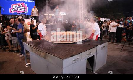 190829 LESKOVAC SERBIA Aug. 29 2019 Xinhua Grill masters make the world s biggest pljeskavica burger at the Rostiljijada Barbecue Festival in Leskovac Serbia on Aug. 29 2019. Grill masters from