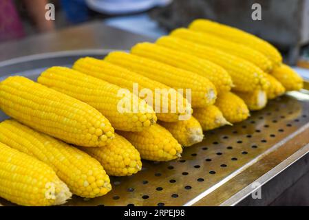 Boiled cooked corn in Jalan Alor street food in Kuala Lumpur Stock Photo