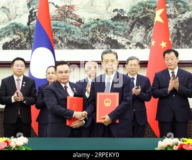 Beijing, China. 4th Sep, 2023. Zhao Leji, chairman of the National People's Congress (NPC) Standing Committee, and visiting Lao National Assembly President Saysomphone Phomvihane sign an agreement on cooperation between the NPC and the Lao National Assembly after their talks at the Great Hall of the People in Beijing, capital of China, Sept. 4, 2023. Credit: Pang Xinglei/Xinhua/Alamy Live News Stock Photo