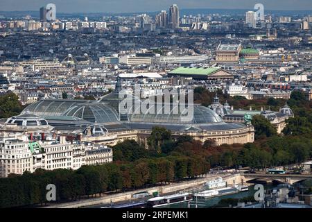 Aerial view of the Grand Palais and Petit Palais alongside the Seine river near the Pont des Invalides. Behind are also visible the Église de la Madel Stock Photo