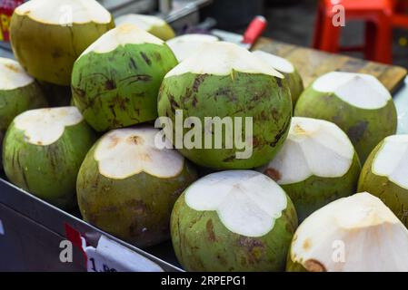 Many fresh coconuts in the stall of Kuala Lumpur market Stock Photo