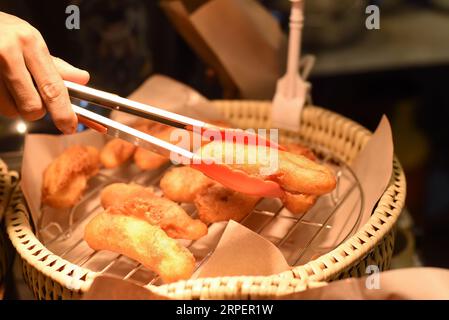 Fried banana in the street food Jalan Alor in Kuala Lumpur Stock Photo