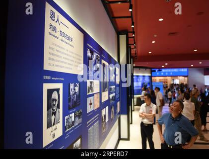 (190903) -- BEIJING, Sept. 3, 2019 -- People visit an exhibition on John Rabe at the Museum of the War of Chinese People s Resistance Against Japanese Aggression in Beijing, capital of China, Sept. 3, 2019. The exhibition, which opened Tuesday in Beijing, recast 30 years of life experience of the German businessman in China, who helped protect Chinese citizens during the 1937 Nanjing Massacre. A total of 151 historical photos are on display at the exhibition, which consists of four parts with details from the Rabe family, his life in China and his contribution to Sino-German relations. ) CHINA Stock Photo
