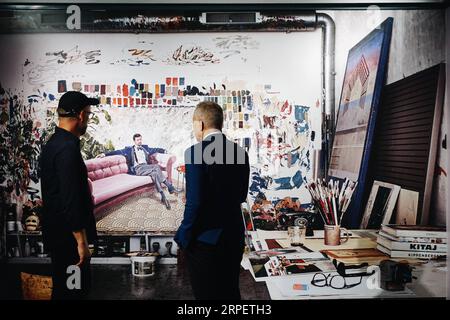 (190904) -- BEIJING, Sept. 4, 2019 -- Visitors view a painting during an exhibition held at Prince Kung s Mansion in Beijing, capital of China, Sept. 4, 2019. An exhibition featuring paintings by Danish artist Kasper Eistrup kicked off in Prince Kung s Mansion on Wednesday. The painting exhibition showed mostly portraits of contemporary musicians by Eistrup, who is also a former singer and guitarist. ) CHINA-BEIJING-EXHIBITION-DENMARK-PAINTINGS (CN) CuixBowen PUBLICATIONxNOTxINxCHN Stock Photo