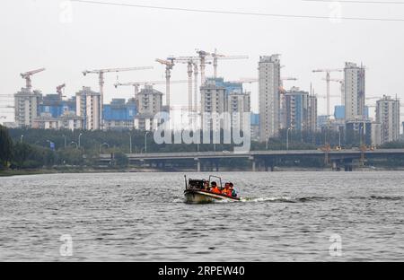 (190905) -- BEIJING, Sept. 5, 2019 -- People ride a speedboat on the Grand Canal in Tongzhou District, sub-center of Beijing, capital of China, Sept. 4, 2019. The Grand Canal, almost 3,200 kilometers in total length, is the world s longest man-made waterway, stretching from Beijing to Hangzhou, capital of east China s Zhejiang Province. It has a history of more than 2,500 years. In recent years, by dredging rivers and pollution control, the Grand Canal has become an important flood control, drainage and landscape river channel in the sub-center of Beijing. ) CHINA-BEIJING-GRAND CANAL (CN) Jinx Stock Photo