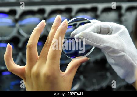 (190908) -- BEIJING, Sept. 8, 2019 -- A worker checks glasses at a glasses company in Danyang City, east China s Jiangsu Province, July 12, 2018. ) Xinhua Headlines: Bikinis, guitars and glasses...How China s small towns meet global demand LixBo PUBLICATIONxNOTxINxCHN Stock Photo