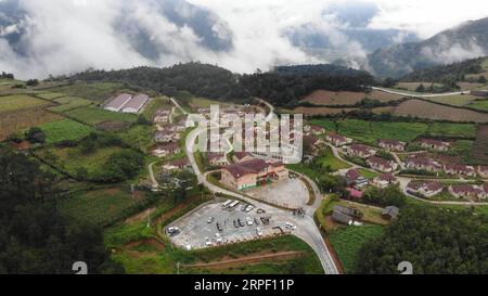 (190909) -- MIANNING, Sept. 9, 2019 -- Aerial photo taken on July 16, 2019 shows the view of Yihai Village in Mianning County, Liangshan Prefecture, southwest China s Sichuan Province. In recent years, the development of red tourism, which refers to visits to historical sites with a revolutionary legacy, has helped improve the employment rate and increase the incomes of local villagers in Yihai Village. With the establishment of the red tourism scenic area and the implementation of poverty relief policies, more than 110 poverty-stricken families in the village has got out of poverty. ) CHINA-S Stock Photo