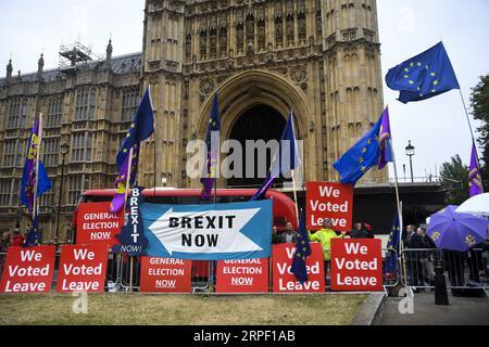 News Bilder des Tages (190909) -- LONDON, Sept. 9, 2019 -- Demonstrators gather outside the Houses of Parliament holding placards in London, Britain, on Sept. 9, 2019. The British parliament will be prorogued at the close of business on Monday night until Oct. 14, Downing Street confirmed. The move came after Prime Minister Boris Johnson requested the Queen to allow such a suspension, from a date this week until Oct. 14. (Photo by Alberto Pezzali/Xinhua) BRITAIN-LONDON-BREXIT-PARLIAMENT-PROROGATION HanxYan PUBLICATIONxNOTxINxCHN Stock Photo