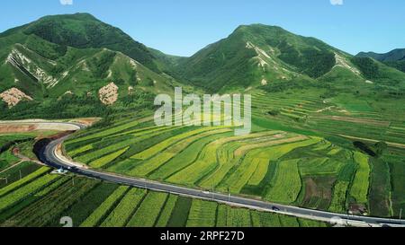 (190910) -- BEIJING, Sept. 10, 2019 -- Aerial photo taken on July 17, 2018 shows the scenery of Qianzhuang Village of Longde County in Guyuan City, northwest China s Ningxia Hui Autonomous Region. Located in the northwestern China, Ningxia is rich in natural beauties ranging from waterside landscape to scenery in cold regions. As an important protection barrier of ecological system in northwestern China, Ningxia plays a significant role in safeguarding the whole country s ecological environment. Surrounded by deserts on three sides, Ningxia is faced with arduous tasks on desertification contro Stock Photo