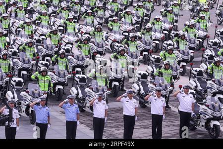 (190912) -- BEIJING, Sept. 12, 2019 -- Traffic police attend a launching ceremony at the Yongdingmen square in Beijing, capital of China, Sept. 12, 2019. The first batch of 185 traffic policemen began to patrol in the city on motorbikes on Thursday morning. ) CHINA-BEIJING-TRAFFIC POLICE ON MOTORBIKES (CN) YinxGang PUBLICATIONxNOTxINxCHN Stock Photo