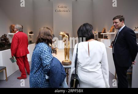 (190913) -- PARIS, Sept. 13, 2019 -- People visit an exhibition preview of the La Biennale Paris 2019 at the Grand Palais in Paris, France, Sept. 12, 2019. The 31st edition of La Biennale Paris kicked off on Friday at the Grand Palais in Paris. This year s exhibition attracted over 70 exhibitors showing their pieces of antique furniture, jewelry, paintings, clocks, watches, etc. ) FRANCE-PARIS-LA BIENNALE PARIS GaoxJing PUBLICATIONxNOTxINxCHN Stock Photo