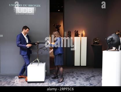 (190913) -- PARIS, Sept. 13, 2019 -- Exhibitors prepare for the La Biennale Paris 2019 at the Grand Palais in Paris, France, Sept. 12, 2019. The 31st edition of La Biennale Paris kicked off on Friday at the Grand Palais in Paris. This year s exhibition attracted over 70 exhibitors showing their pieces of antique furniture, jewelry, paintings, clocks, watches, etc. ) FRANCE-PARIS-LA BIENNALE PARIS GaoxJing PUBLICATIONxNOTxINxCHN Stock Photo