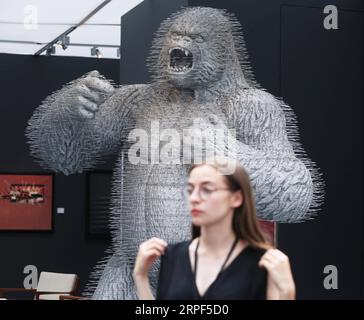 (190913) -- PARIS, Sept. 13, 2019 -- A woman visits an exhibition preview of the La Biennale Paris 2019 at the Grand Palais in Paris, France, Sept. 12, 2019. The 31st edition of La Biennale Paris kicked off on Friday at the Grand Palais in Paris. This year s exhibition attracted over 70 exhibitors showing their pieces of antique furniture, jewelry, paintings, clocks, watches, etc. ) FRANCE-PARIS-LA BIENNALE PARIS GaoxJing PUBLICATIONxNOTxINxCHN Stock Photo