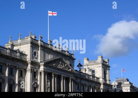 A Saint George's Cross flag being flown over, the office of HM Revenue and Customs, 100 Parliament Street, London, UK.  18 Nov 2022 Stock Photo